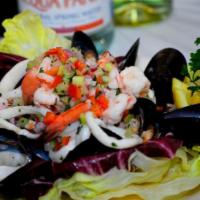 9. Seafood Salad · Calamari, shrimp, mussels and real crabmeat.