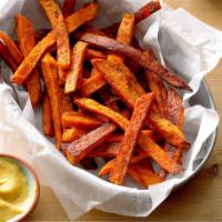 Crispy Sweet Potato Fries · A balance of sweet and savory with a hint of seasoned Cinnamon sugar.