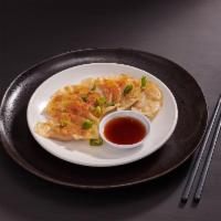 Chicken Gyoza · 6 piece pan fried chicken and negi dumplings, chili oil