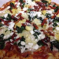 Spinach and Feta Pizza · Spinach, sun dried tomatoes, feta cheese, tomato sauce and mozzarella cheese.