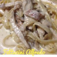 Fettuccini Alfredo · With cream sauce and Parmesan cheese. Served with garlic bread.