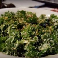 Marinated Kale Caesar Salad · Marinated kale tossed with traditional Caesar dressing and crispy Parmesan crumbles.