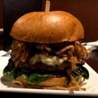 New Yorker Burger · Cracked black pepper seasoned ground beef patty topped with bleu cheese crumbles, wilted bab...