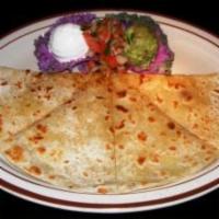 Cheese Quesadilla · A flour tortilla filled with Monterrey Jack cheese topped with fresh guacamole and sour cream.