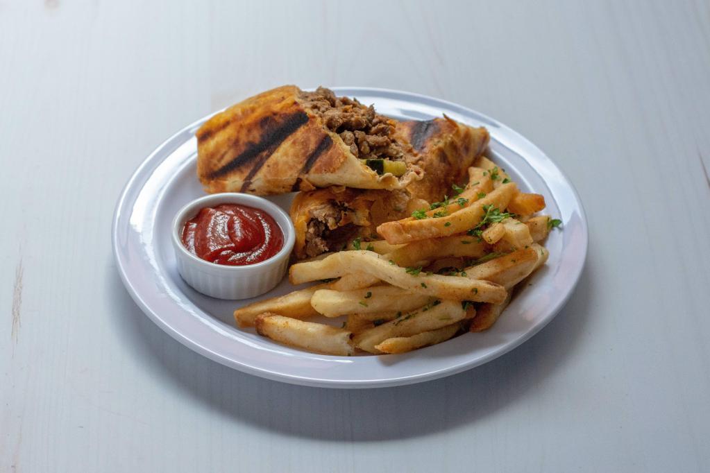 Beef Shawarma · Layers of beef marinated and broiled to perfection. Served with rice and a side salad.
