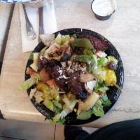 Souvlaki Plate · Served with rice, Greek salad, pita bread and tzatziki. Charbroiled steak.