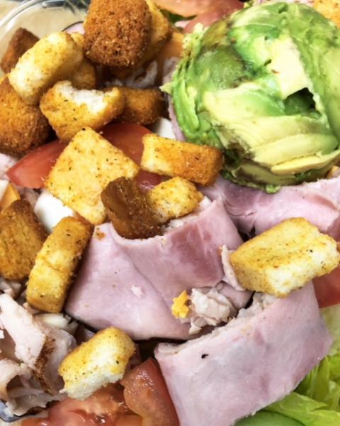 Chef Salad · Iceberg and romaine lettuce, tomatoes, cucumbers, ham, turkey, avocado, provolone, and American cheese, boiled egg and croutons.