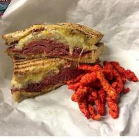 Hot Reuben Sandwich · Corned beef, sauerkraut, swiss cheese, mustard, and thousand island on toasted rye.