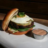 Bison is Gouda Burger · Organic bison, smoked gouda, bacon onion jam, sunny side up egg, baby spinach, scallions, ho...