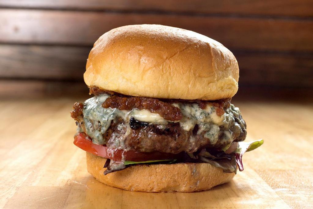 Beef and Blue Burger · All natural beef, Danish blue cheese, organic mixed greens, tomatoes, bacon onion jam, garlic aioli and brioche bun.