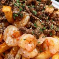Surf and turf French Fries  · Crispy French Fries,  melted mozzarella 
Skirt Steak, Garlic Shrimps with jalapenos 