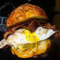 The Wise Guy Burger · Topped with Applewood smoked bacon, fried egg and Irish cheddar cheese.