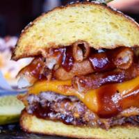 Bada Bing BBQ Burger · Beef patty stuffed with bacon and cheddar cheese; topped with extra cheddar cheese, whisky b...