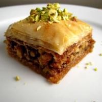 1. Baqlawa · Thin layers of syrup-soaked pastry with walnuts and topped with ground pistachios.