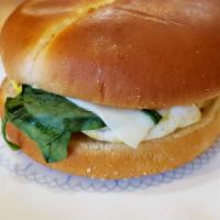 Vegetarian Breakfast Sandwich · Smith Brothers egg, mozzarella cheese, baby spinach and tomatoes. Brioche bread.