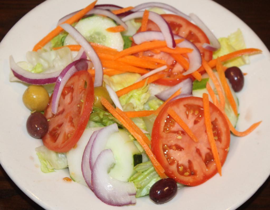House Salad · Iceberg lettuce, tomatoes, cucumbers, carrots, red onion, black and green olives served with Italian dressing. Served with dressing on the side.