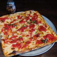 Grandma Pizza · Old fashioned square pizza, thin crust, marinara sauce, light mozzarella cheese, basil and o...