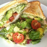 Turkey Melt Sandwich · Turkey, bacon, avocado, tomato on grilled sourdough with pesto mayonnaise and provolone chee...