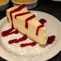 New York Style Cheesecake · Served with Raspberry sauce on the side.