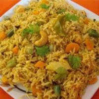 Vegetable Biryani · Basmati rice cooked with vegetables, herbs and spices. Served with raita.