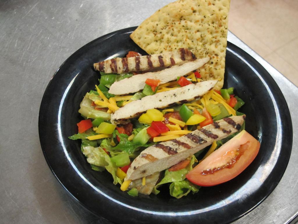 Nick's Chicken and Cheddar Salad · Spring mix tossed with blackened chicken breast, cheddar cheese, red bell pepper, avocado, and cucumber. Served with our house made balsamic vinaigrette. 