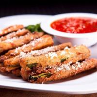Fried Zucchini · Delicious hand breaded deep fried zucchini sticks. Served with a side of marinara.
