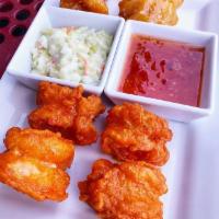 Buffalo Shrimp · (6) shrimp with a tempura-like batter tossed in our house buffalo sauce, served with ranch.