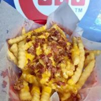 Cheddar Cheese and Bacon Fries · Deep fried & salted potatoes topped with melted cheddar cheese and bacon bits.