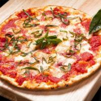 Thin Crust Margherita Pizza · Olive oil, plum tomatoes, fresh garlic, and fresh basil topped with mozzarella.