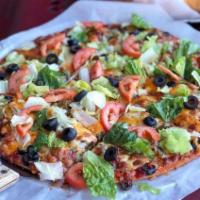 Taco Pizza (Thin Crust) · Ground beef, pepperoni, black olives, topped with mozzarella and cheddar cheese, lettuce, fr...