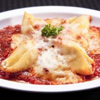 4 Stuffed Shell Dinner · Shells filled with ricotta cheese topped with marinara sauce, then baked with Parmesan and m...