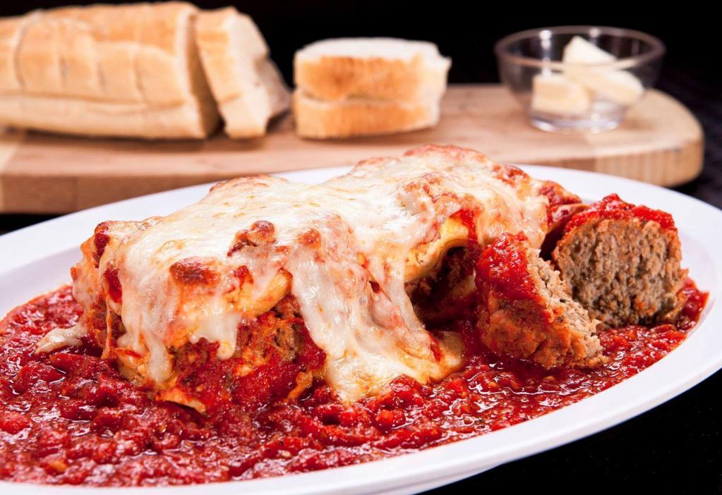 Homemade Lasagna Dinner · Layers of pasta and ricotta cheese with meat filling topped with marinara sauce, then baked with mozzarella cheese.