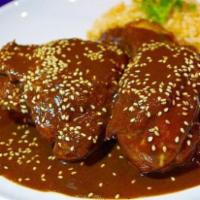 Chicken Mole · Mexican sauce with chocolate and chipotle chile. Rice and beans