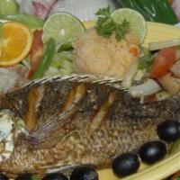 Pescado a La Veracruzana · White tilapia fish with black olives, onions, tomatoes and jalapenos cooked with white wine.