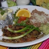 Carne Asada Dinner · 8oz top sirloin. Includes beans, rice, baked potatoe, lettuce and your choice of tortillas.