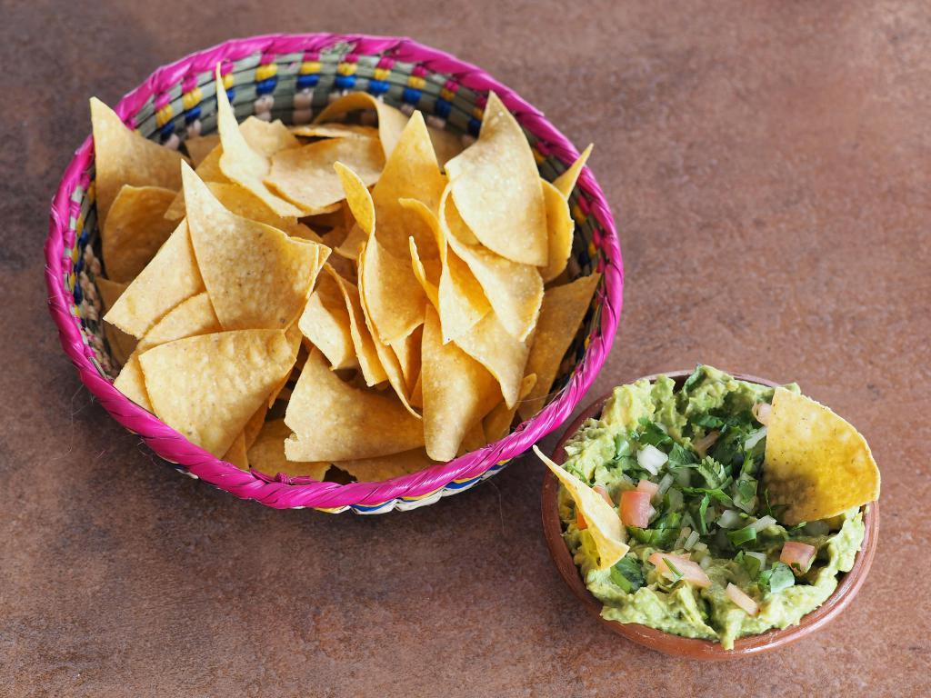 Guacamole · Fresh and chucky avocado with pico de gallo. Served with house made tortilla chips and salsa.