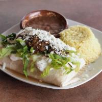 Rib Eye Steak Chimichangas · Marinated in adobo sauce. Flash-fried burrito filled with onions, peppers, cheese and topped...