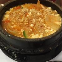 11. Fried Noodle Soft Tofu Soup · Tofu boiled with ramen and vegetables.