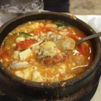 13. Crab Soft Tofu Soup · Tofu boiled with crab and assorted vegetables.