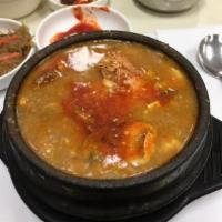 14. BBQ and Octopus Soft Tofu Soup · Tofu boiled with sliced BBQ beef, octopus and mushrooms.