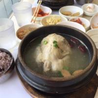 26. Ginseng Chicken · Boiled chicken with ginseng, milk vetch root, jujube, and sticky rice served in chicken broth.