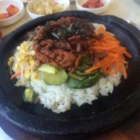 29. BBQ Pork and Vegetables in Stoneware · Rice, BBQ sliced spicy pork and vegetables served in stoneware.