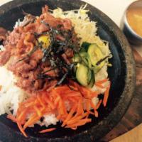 31. BBQ Beef and Vegetables over Rice in Bowl · Rice, BBQ beef, and vegetables served in a bowl.
