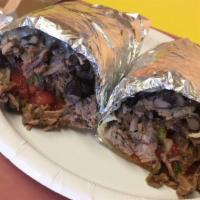 6 oz. Steak Burrito · Chile rubbed. Fresh hot large flour tortilla. Includes rice, beans, salsa and hot sauce.