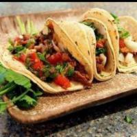 Steak Taco · Chile rubbed. Fresh hot corn tortilla. Includes salsa, lettuce, hot sauce and lime wedge.