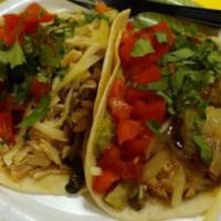 Grilled Vegetable Taco · Red onions, peppers, zucchini and beans. Fresh hot corn tortilla. Includes salsa, lettuce, h...