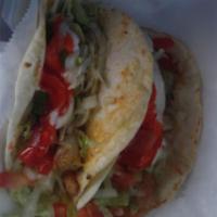 Fish Taco · Fresh hot corn tortilla. Includes salsa, lettuce, hot sauce and lime wedge.