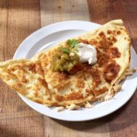 Carnitas Quesadilla · Seasoned pork simmered in beer broth, then browned. Includes cheese, salsa and hot sauce.