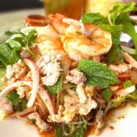 Y8. Glass Noodles Salad · Steamed glass noodles, ground chicken, shrimps, squid, green onions, tomatoes, shallots, and...