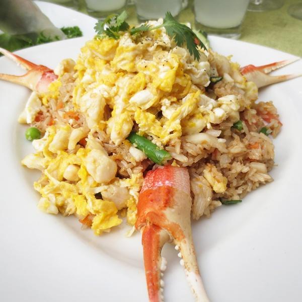 R6. Crab Fried Rice · Stir-fried jasmine rice blended with egg, onions, tomatoes, diced mix vegetables, and dungeness crabmeat.